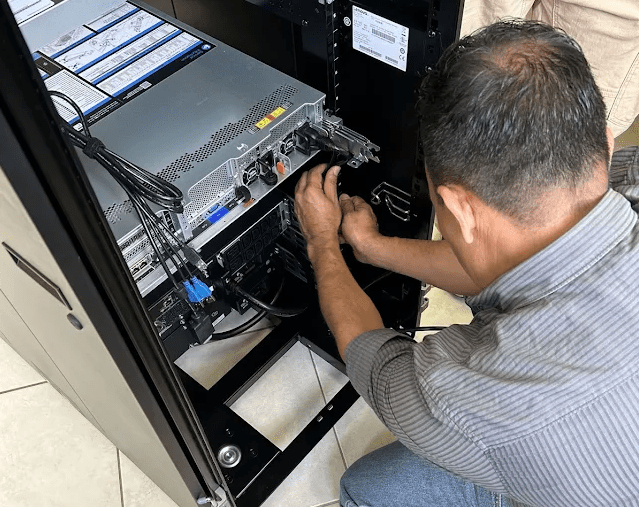 AZ Managed IT engineer servicing a client server rack
